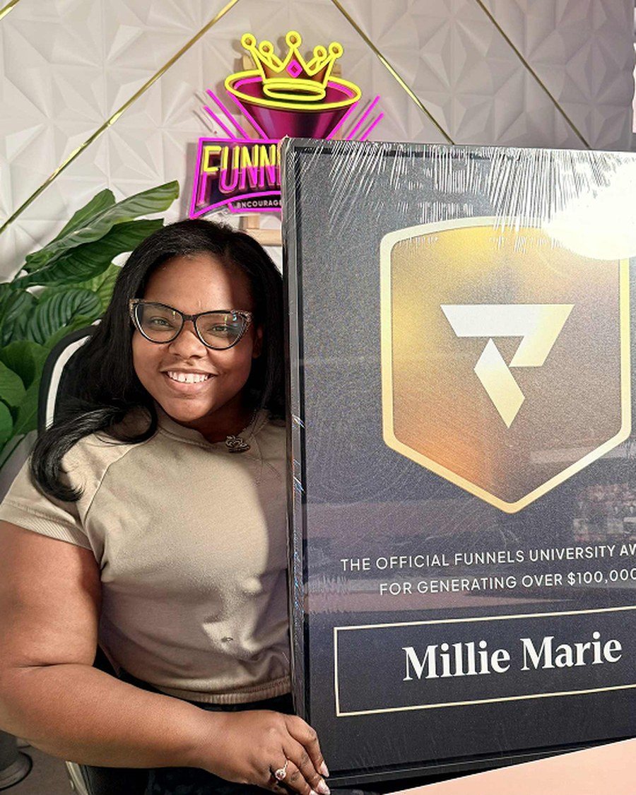 Millie Marie holding the Funnels University $100K Award
