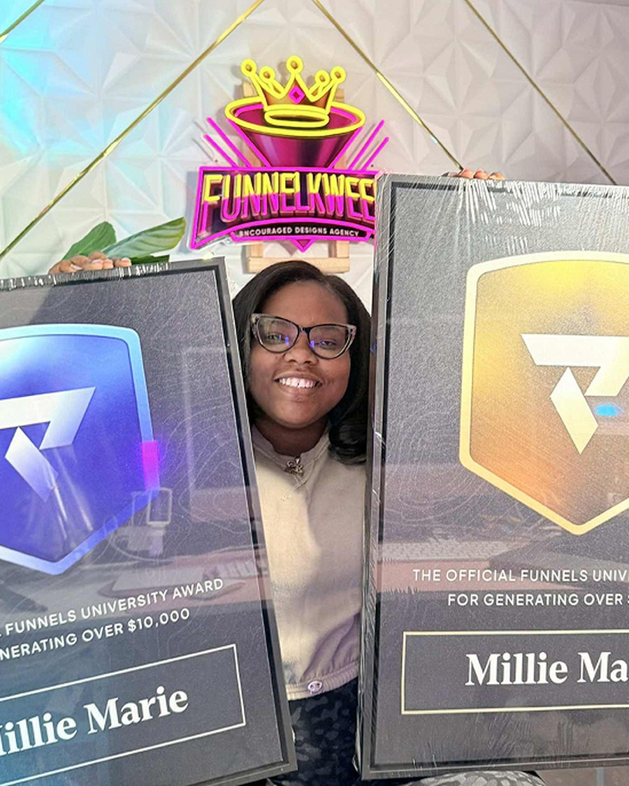 Millie Marie holding the Funnels University $10K & $100K Awards